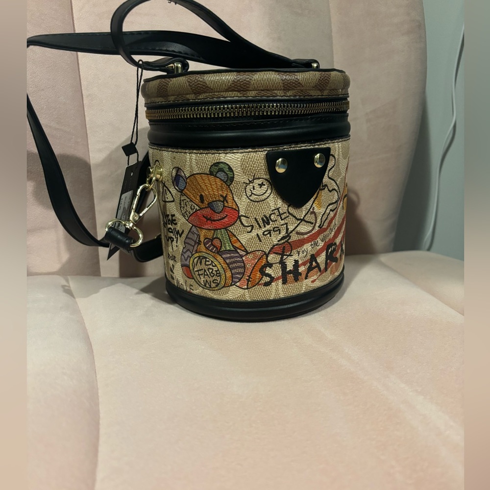 Brand new purse . Brown with Graphics!